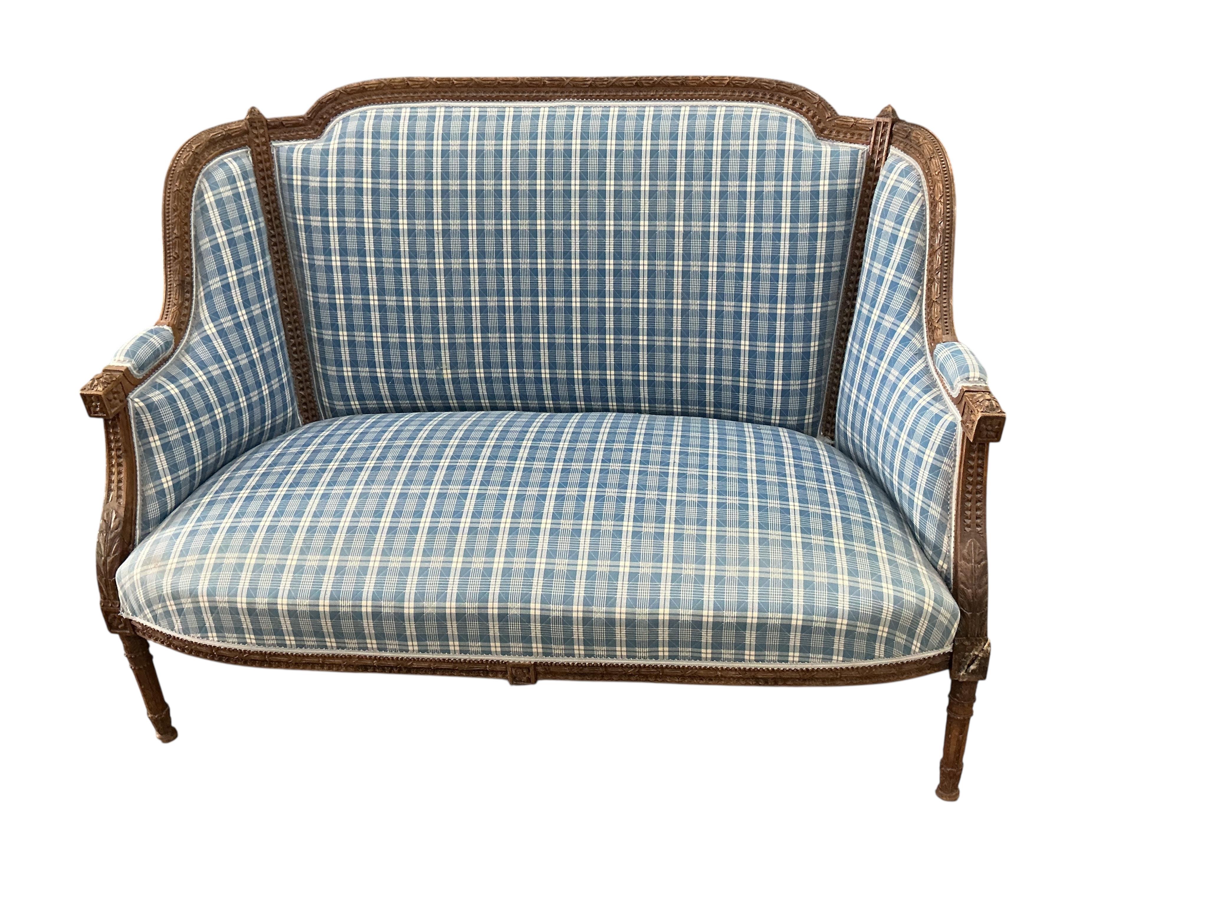 A late 19th century French upholstered settee, width 126cm, depth 60cm, height 94cm, Provenance: The late Kenneth Turner (1936-2025), celebrity florist, designer and perfume retailer, he received the Royal Warrant from t